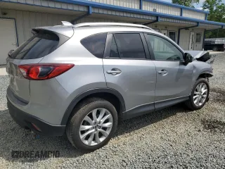 2014 Mazda CX-5 Grand Touring with VIN JM3KE4DY9E0416967, listed as a Copart auction lot 54215285 with 77,296 mi miles and Salvage Title. Bid and sale history available at DreamBid. Image 3.