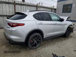 2019 Alfa Romeo Stelvio z VIN ZASPAJAN0K7C71850, wystawiony jako Copart lot #54234205 z przebiegiem Nie podano mil oraz Szkoda całkowita • Salvage title. Historia ofert i sprzedaży dostępna na DreamBid. Obrazek 3.