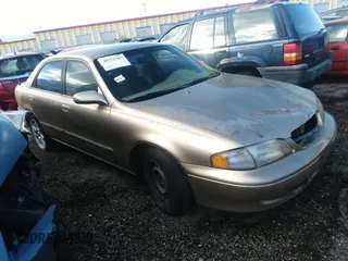1998 Mazda 626 DX z VIN 1YVGF22C0W5719965, wystawiony jako IAAI lot #30771187 z przebiegiem 193 437 mil mil oraz . Historia ofert i sprzedaży dostępna na DreamBid. Obrazek 1.
