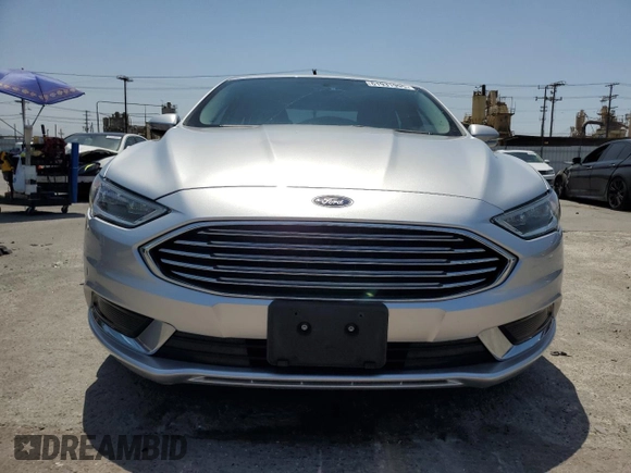 2018 Ford Fusion SE z VIN 3FA6P0LU8JR110693, wystawiony jako Copart lot #61931995 z przebiegiem 119 629 mil mil oraz Szkoda całkowita • Salvage title. Historia ofert i sprzedaży dostępna na DreamBid. Obrazek 5.