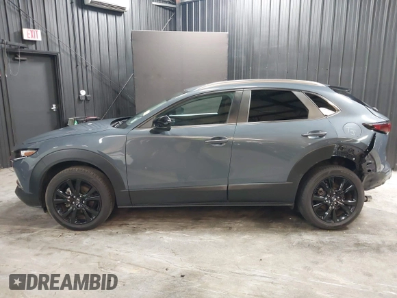 2022 Mazda CX-30 S Carbon Edition with VIN 3MVDMBCL8NM447234, listed as a IAAI auction lot 42511600 with 51,926 mi miles and . Bid and sale history available at DreamBid. Image 14.