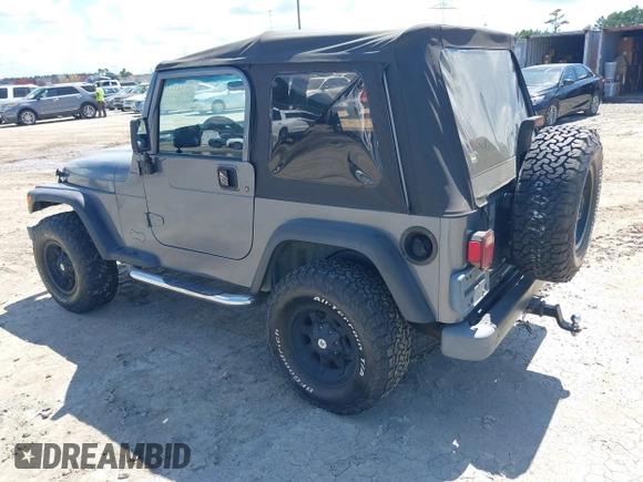 2002 Jeep Wrangler Sport z VIN 1J4FA49S62P731507, wystawiony jako IAAI lot #42584222 z przebiegiem 206 661 mil mil oraz . Historia ofert i sprzedaży dostępna na DreamBid. Obrazek 3.