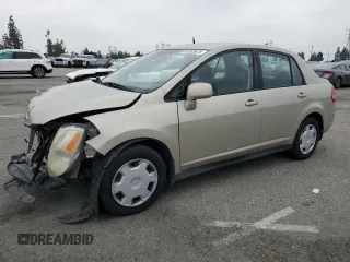 2009 Nissan Versa S with VIN 3N1BC11E79L433933, listed as a Copart auction lot 54953675 with 196,785 mi miles and Salvage Title. Bid and sale history available at DreamBid. Image 1.