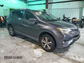 2016 Toyota RAV4 XLE with VIN 2T3RFREV3GW423028, listed as a Copart auction lot 63466735 with 164,207 mi miles and Salvage title. Bid and sale history available at DreamBid. Image 4.