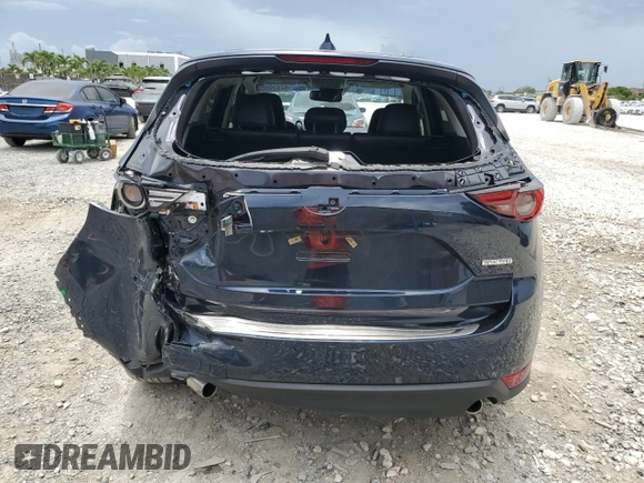 2021 Mazda CX-5 Grand Touring z VIN JM3KFBDM5M0464611, wystawiony jako Copart lot #62829065 z przebiegiem 20 525 mil mil oraz Nie do naprawy • Non repairable. Historia ofert i sprzedaży dostępna na DreamBid. Obrazek 6.