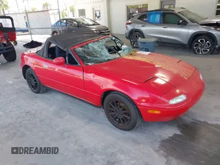 1991 Mazda MX-5 Miata Special Edition z VIN JM1NA3514M1238049, wystawiony jako IAAI lot #42252311 z przebiegiem 81 564 mil mil oraz . Historia ofert i sprzedaży dostępna na DreamBid. Obrazek 1.