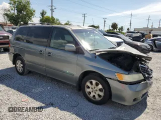 2002 Honda Odyssey EX-L with VIN 2HKRL18962H552809, listed as a Copart auction lot 63631115 with 224,019 mi miles and Salvage title. Bid and sale history available at DreamBid. Image 4.