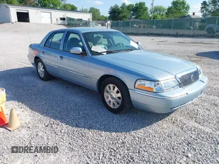 2005 Mercury Grand Marquis LS Premium z VIN 2MEFM75W15X621971, wystawiony jako IAAI lot #42130811 z przebiegiem 129 700 mil mil oraz . Historia ofert i sprzedaży dostępna na DreamBid. Obrazek 1.