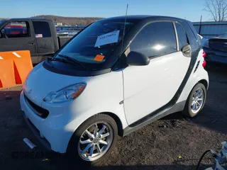 2009 Smart fortwo Pure z VIN WMEEJ31X99K292492, wystawiony jako IAAI lot #41029051 z przebiegiem 57 741 mil mil oraz . Historia ofert i sprzedaży dostępna na DreamBid. Obrazek 17.