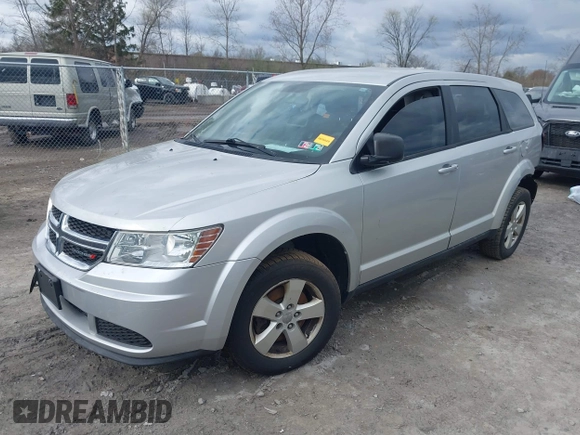 2013 Dodge Journey SE with VIN 3C4PDCAB9DT532554, listed as a IAAI auction lot 42026129 with 164,599 mi miles. Bid and sale history available at carsss.com. Image 2.