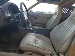 1980 Datsun 280ZX z VIN HS130221335, wystawiony jako Copart lot #81964444 z przebiegiem 135 266 mil mil oraz Szkody całkowita. Historia ofert i sprzedaży dostępna na DreamBid. Obrazek 7.