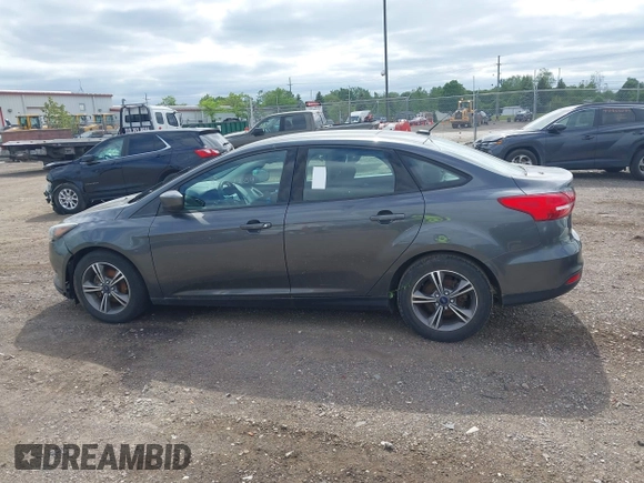 2018 Ford Focus SE z VIN 1FADP3FE5JL228583, wystawiony jako IAAI lot #42313614 z przebiegiem 84 240 mil mil oraz . Historia ofert i sprzedaży dostępna na DreamBid. Obrazek 14.