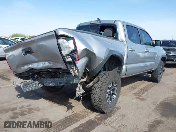 2018 Toyota Tacoma SR5 with VIN 3TMAZ5CN0JM053861, listed as a IAAI auction lot 41920377 with 104,015 mi miles and . Bid and sale history available at DreamBid. Image 4.
