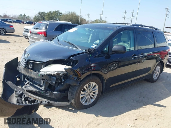 2014 Toyota Sienna XLE with VIN 5TDYK3DC2ES492554, listed as a IAAI auction lot 41685109 with 196,619 mi miles and . Bid and sale history available at DreamBid. Image 2.