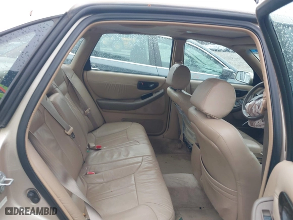 1997 Toyota Avalon XL with VIN 4T1BF12B1VU198756, listed as a IAAI auction lot 41613887 with 217,863 mi miles. Bid and sale history available at carsss.com. Image 8.