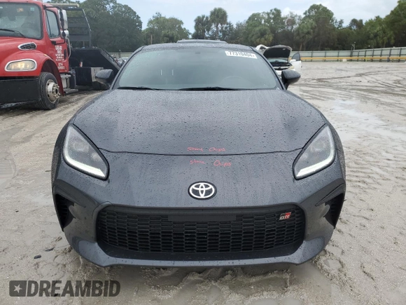 2022 Toyota GR86 Premium with VIN JF1ZNBE13N9757764, listed as a Copart auction lot 77310404 with 12,589 mi miles and Salvage Title. Bid and sale history available at carsss.com. Image 5.