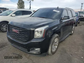 2019 GMC Yukon SLE with VIN 1GKS1AKC2KR101675, listed as a Copart auction lot 87256804 with 144,572 mi miles and Salvage Title. Bid and sale history available at carsss.com. Image 1.