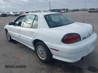 1997 Pontiac Grand Am SE with VIN 1G2NE52T3VC809661, listed as a IAAI auction lot 41100711 with 168,686 mi miles. Bid and sale history available at carsss.com. Image 3.