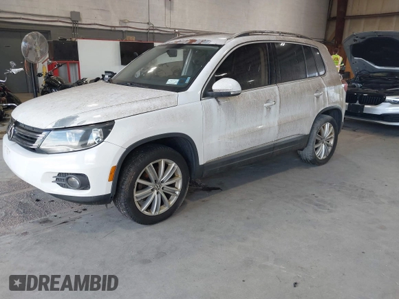 2012 Volkswagen Tiguan SE with VIN WVGAV7AXXCW533237, listed as a IAAI auction lot 42670923 with 227,323 mi miles and . Bid and sale history available at DreamBid. Image 2.