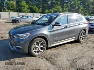 2017 BMW X1 xDrive28i with VIN WBXHT3C34H5F86322, listed as a Copart auction lot 61017595 with 62,356 mi miles and Salvage title. Bid and sale history available at DreamBid. Image 1.