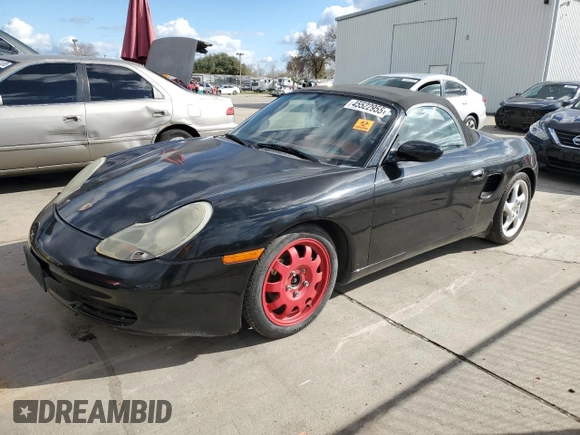 2000 Porsche Boxster z VIN WP0CA2988YU627807, wystawiony jako Copart lot #45522955 z przebiegiem 120 384 mil mil oraz Szkody całkowita. Historia ofert i sprzedaży dostępna na DreamBid. Obrazek 1.
