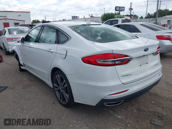 2020 Ford Fusion Titanium с VIN 3FA6P0D98LR151810, выставлен на аукционе IAAI как лот 42590902 с пробегом 76 624 миль миль и . История ставок и продаж доступна на DreamBid. Изображение 3.