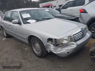 1999 Ford Crown Victoria LX with VIN 2FAFP74W9XX236645, listed as a IAAI auction lot 41464257 with 324,477 mi miles. Bid and sale history available at carsss.com. Image 1.