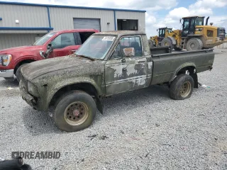 1982 Toyota Pickup z VIN JT4RN48S6C0055479, wystawiony jako Copart lot #59720265 z przebiegiem 276 956 mil mil oraz Czysty tytuł • Clean title. Historia ofert i sprzedaży dostępna na DreamBid. Obrazek 1.