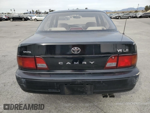 1995 Toyota Camry LE with VIN JT2GK12E2S0079545, listed as a Copart auction lot 84058164 with 150,539 mi miles and Salvage Title. Bid and sale history available at carsss.com. Image 6.
