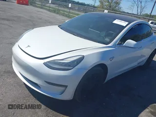 2019 Tesla Model 3 Mid Range with VIN 5YJ3E1EA7KF425127, listed as a IAAI auction lot 41886436 with 87,236 mi miles and . Bid and sale history available at carsss.com. Image 2.