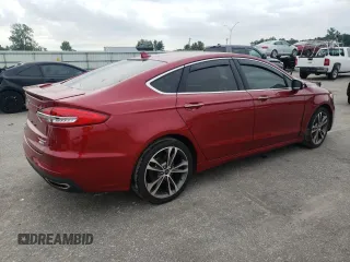 2019 Ford Fusion Titanium z VIN 3FA6P0D99KR221328, wystawiony jako Copart lot #57104515 z przebiegiem 138 427 mil mil oraz Szkoda całkowita • Salvage title. Historia ofert i sprzedaży dostępna na DreamBid. Obrazek 3.