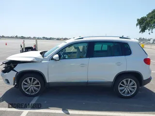 2014 Volkswagen Tiguan SEL with VIN WVGAV3AX9EW512956, listed as a IAAI auction lot 42110002 with 136,034 mi miles and . Bid and sale history available at DreamBid. Image 14.