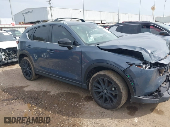 2023 Mazda CX-5 S Carbon Edition z VIN JM3KFBCM6P0288402, wystawiony jako IAAI lot #41682386 z przebiegiem 30 482 mil mil oraz . Historia ofert i sprzedaży dostępna na DreamBid. Obrazek 13.
