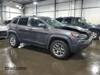 2020 Jeep Cherokee Trailhawk with VIN 1C4PJMBX9LD582951, listed as a Copart auction lot 60152935 with 61,448 mi miles and Salvage title. Bid and sale history available at DreamBid. Image 4.