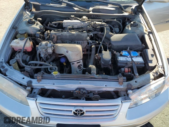 2000 Toyota Camry CE z VIN 4T1BG22K2YU711908, wystawiony jako Copart lot #56294515 z przebiegiem 110 871 mil mil oraz Szkoda całkowita • Salvage title. Historia ofert i sprzedaży dostępna na DreamBid. Obrazek 11.