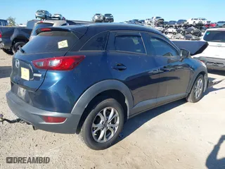2017 Mazda CX-3 Sport with VIN JM1DKFB73H0159678, listed as a IAAI auction lot 40953743 with 99,696 mi miles. Bid and sale history available at carsss.com. Image 4.