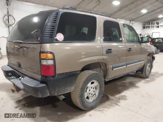 2004 Chevrolet Tahoe LS with VIN 1GNEK13Z34J166486, listed as a IAAI auction lot 41821497 with 164,388 mi miles. Bid and sale history available at carsss.com. Image 4.