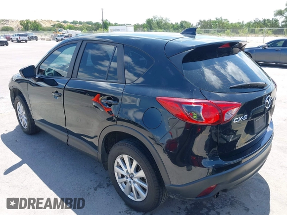 2014 Mazda CX-5 Sport with VIN JM3KE2BE9E0402015, listed as a IAAI auction lot 42098197 with 65,328 mi miles and . Bid and sale history available at carsss.com. Image 3.