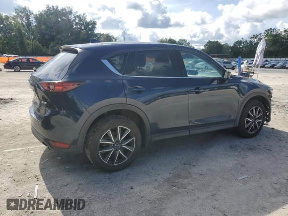 2018 Mazda CX-5 Grand Touring with VIN JM3KFBDMXJ0350499, listed as a Copart auction lot 63475745 with 119,642 mi miles and Salvage title. Bid and sale history available at DreamBid. Image 3.