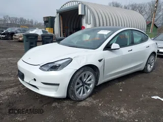2023 Tesla Model 3 Long Range with VIN 5YJ3E1EB8PF600291, listed as a IAAI auction lot 41651156 with 37,055 mi miles and . Bid and sale history available at DreamBid. Image 6.