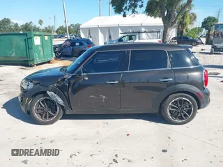 2015 MINI Countryman S with VIN WMWZC3C58FWT04316, listed as a IAAI auction lot 42525698 with 97,046 mi miles and . Bid and sale history available at DreamBid. Image 14.