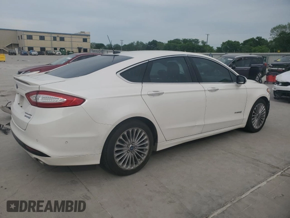 2013 Ford Fusion Titanium Hybrid с VIN 3FA6P0RU3DR282013, выставлен на аукционе Copart как лот 53651595 с пробегом 133 214 миль миль и Списание • Salvage title. История ставок и продаж доступна на DreamBid. Изображение 3.