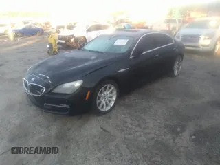 2014 BMW 6 Series 640i z VIN WBA6A0C55EDZ04549, wystawiony jako IAAI lot #41764155 z przebiegiem 154 705 mil mil oraz . Historia ofert i sprzedaży dostępna na DreamBid. Obrazek 2.