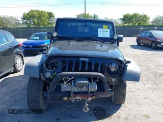 2016 Jeep Wrangler Willys Wheeler z VIN 1C4AJWAG9GL257621, wystawiony jako IAAI lot #41432306 z przebiegiem 84 248 mil mil oraz . Historia ofert i sprzedaży dostępna na DreamBid. Obrazek 12.