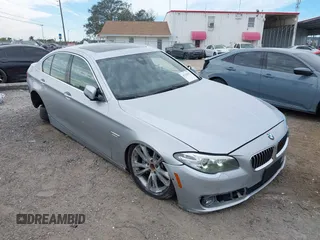 2015 BMW 5 Series 535i xDrive with VIN WBA5B3C54FD544802, listed as a IAAI auction lot 41283822 with 93,828 mi miles. Bid and sale history available at carsss.com. Image 1.