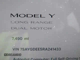 2024 Tesla Model Y Long Range with VIN 7SAYGDEE5RA241433, listed as a IAAI auction lot 41569277 with 7,490 mi miles. Bid and sale history available at carsss.com. Image 7.