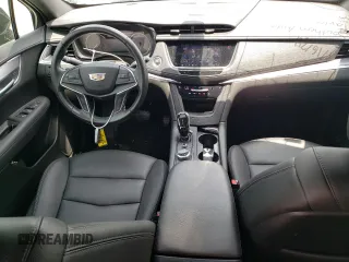 2020 Cadillac XT5 Luxury FWD z VIN 1GYKNAR49LZ197878, wystawiony jako Copart lot #54727524 z przebiegiem 37 990 mil mil oraz Nie do naprawy • Non repairable. Historia ofert i sprzedaży dostępna na DreamBid. Obrazek 8.