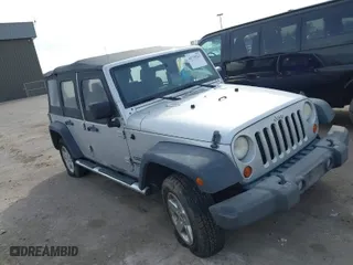 2010 Jeep Wrangler Unlimited Sport with VIN 1J4BA3H10AL112599, listed as a IAAI auction lot 41739263 with 156,301 mi miles. Bid and sale history available at carsss.com. Image 1.