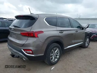 2019 Hyundai Santa Fe SE z VIN 5NMS23AD2KH014037, wystawiony jako IAAI lot #42110778 z przebiegiem 48 975 mil mil oraz . Historia ofert i sprzedaży dostępna na DreamBid. Obrazek 4.