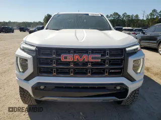 2023 GMC Canyon 4WD AT4X with VIN 1GTP6EEK6P1235222, listed as a Copart auction lot 75664684 with 9,736 mi miles and Salvage Title. Bid and sale history available at carsss.com. Image 5.